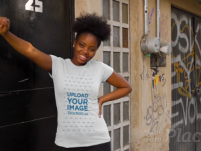 T-Shirt Video of a Happy Woman Posing in an Urban Setting 3403v
