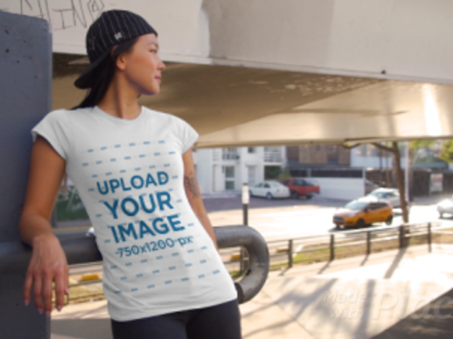 T-Shirt Video of a Woman with an Arm Tattoo Posing by Passing Cars 3426v