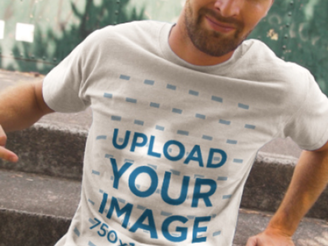 T-Shirt Video of a Man Sitting on a Stair Step Pointing at His Garments 3643v