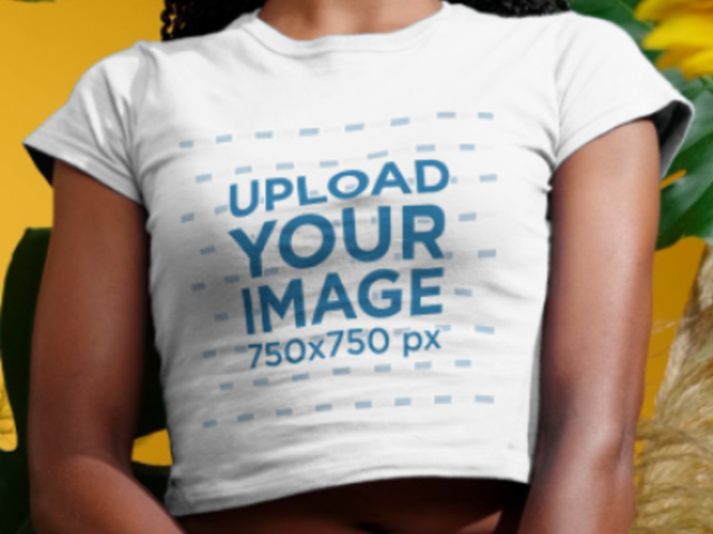 T-Shirt Video of a Serious Woman Posing by Palm Tree Leaves 3733v