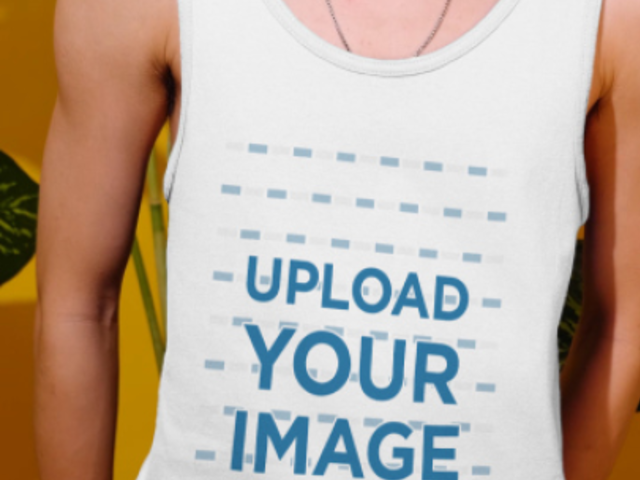 Tank Top Video of a Man Posing by Tropical Leaves 3900v