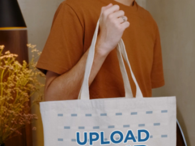 Video of a Young Man Holding a Customizable Tote Bag 4000v