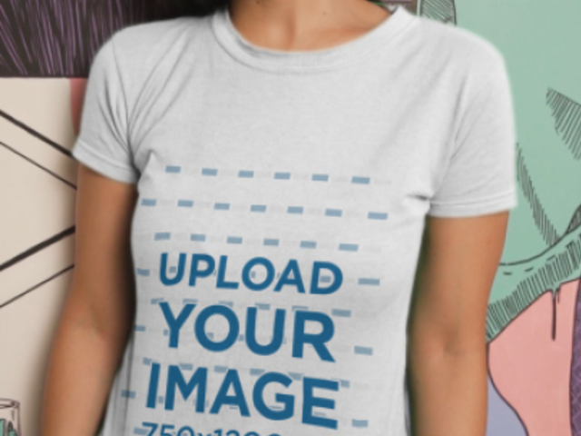 T-Shirt Video Featuring a Young Woman Posing Against a Street Art Mural 3701v