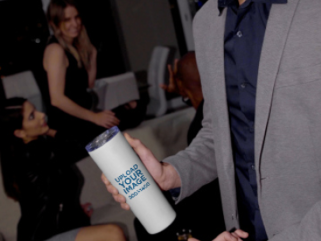 Video of a Man Showing His Skinny Wine Tumbler at a New Year's Gathering 4445v