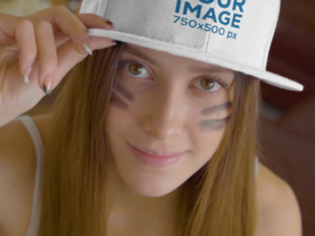 Video of a Woman Pointing at Her Snapback Hat While Watching the Big Game 4505v