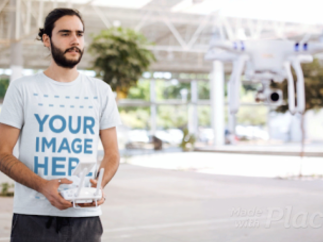 Cinemagraph Mockup of a Young Man Playing With a Helicopter While Using a Round Neck Tee a13367
