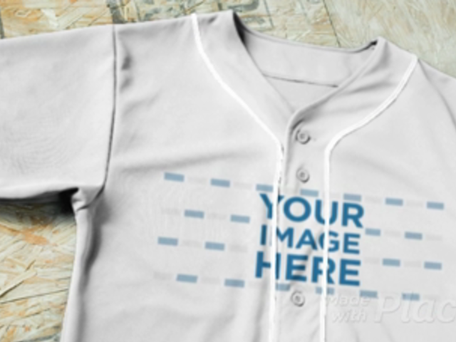 Baseball Uniform Builder - Jersey Lying on a Wooden Floor a16883