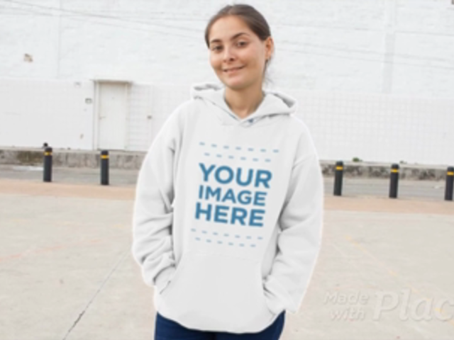 Front Shot of a Woman Wearing a Pullover Hoodie Video Mockup at an Industrial Zone a13117