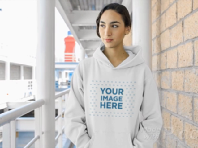 Young Woman Wearing a Pullover Hoodie Video at a Hallway a13207