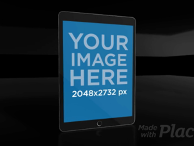 Black iPad Video Floating in a Black Room a15698