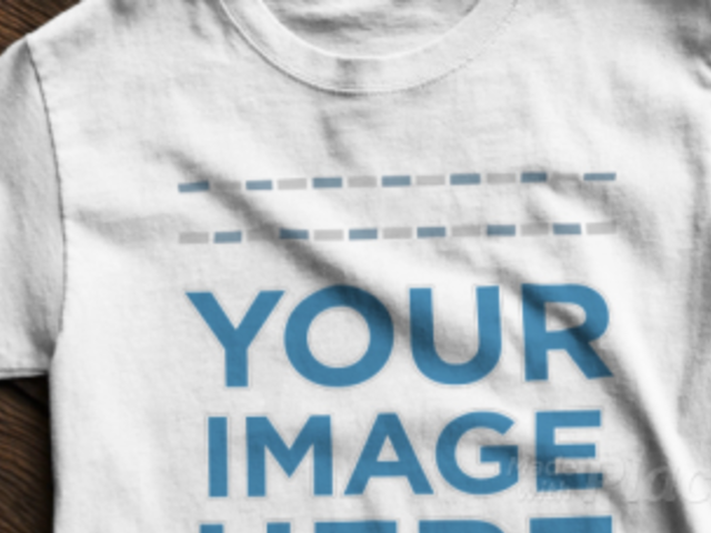 T-Shirt Video Mockup on a Wooden Table a12347