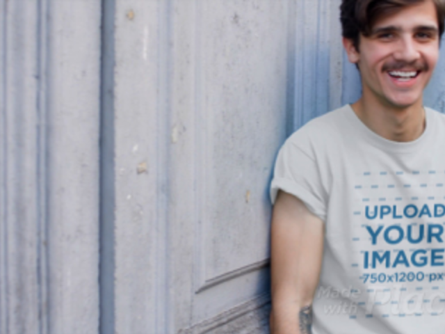 Hipster Young Man with a Mustache Wearing a T-Shirt Video Outdoors a13467