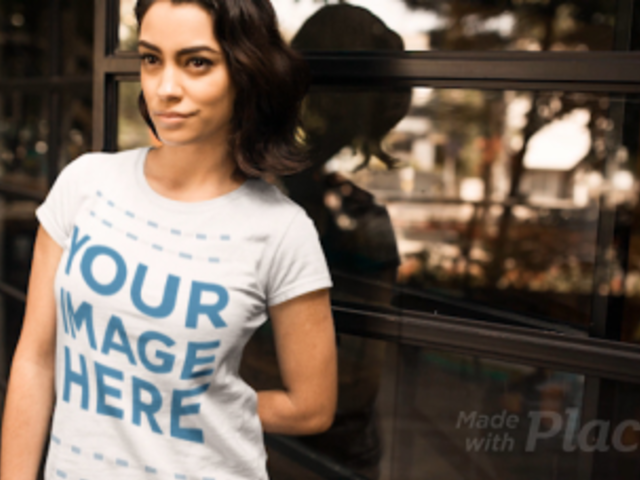 Pretty Girl Wearing a Round Neck T-Shirt Cinemagraph Against a Glass a13441