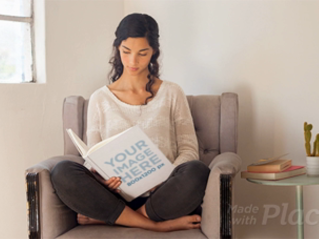 Pretty Girl Reading a Book While Sitting On Her Armchair in Stop Motion a13677