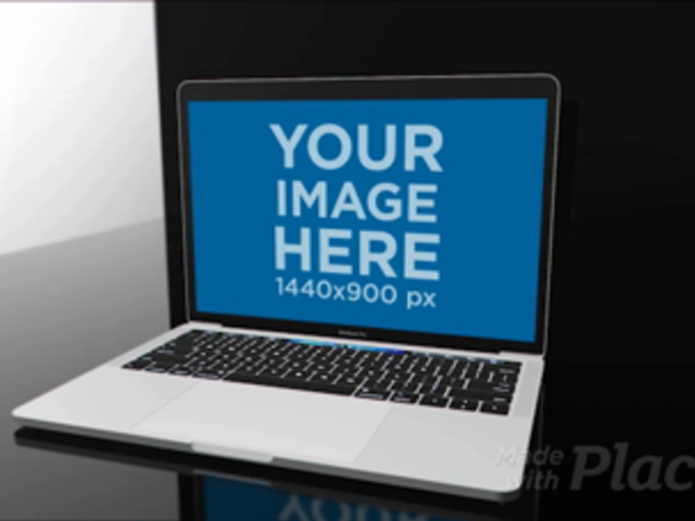 MacBook Pro Video Mockup Lying on a Black and Blue Room a15820b