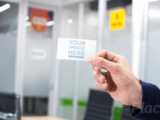 Mockup of a Hand Holding a Business Card Stop Motion in a  Professional Environment a13729