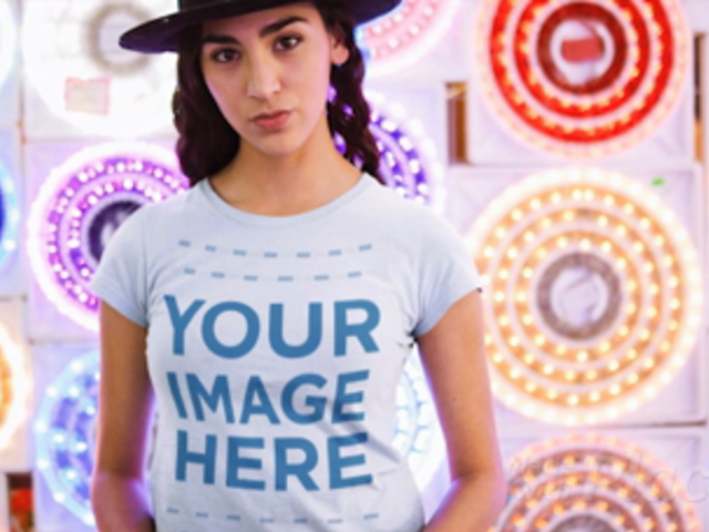 Trendy Girl Wearing a Tshirt Cinemagraph and a Hat Against Flashing Circle Lights a13326