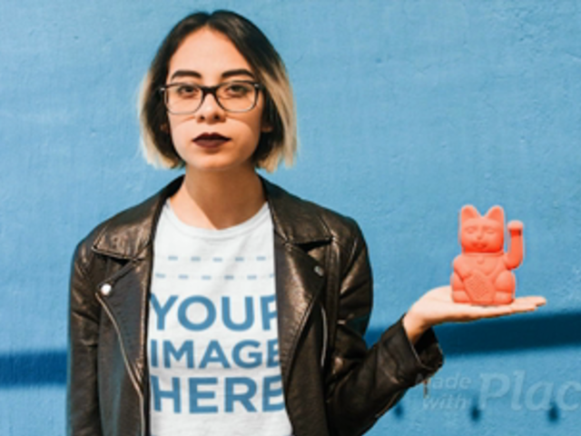Young Girl with a  Leather Jacket Wearing a Tshirt Cinemagraph Holding a Manekineko a13606