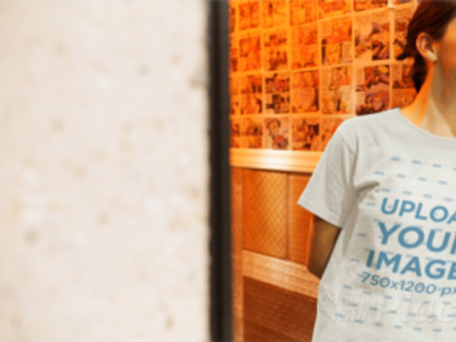 Girl Wearing a Round Neck Tee Video Lying Against Red and Yellow Walls a13073