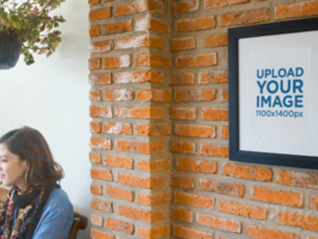 Art Print Video on a Bricks Wall While a Girl Is Texting on Her Phone Nearby a14354