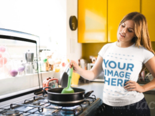 Pretty Young Girl Cooking in Her Kitchen Wearing a T-Shirt Cinemagraph a13479