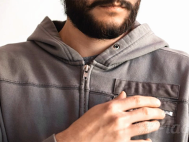 Hipster Dude Opens Takes out a Business Card Stop Motion Out of his Hoodie Pocket a13782