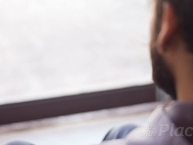 Stop Motion of a Hipster Man at his House Looking at a Business Card a13785