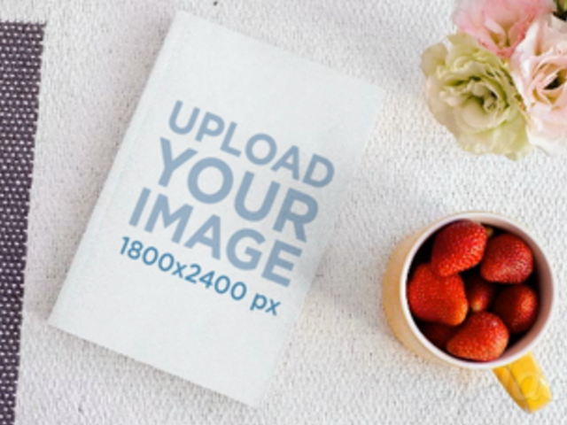 Book Lying on a Friendly Desk While Strawberries Disappear From a Cup in Stop Motion a13872