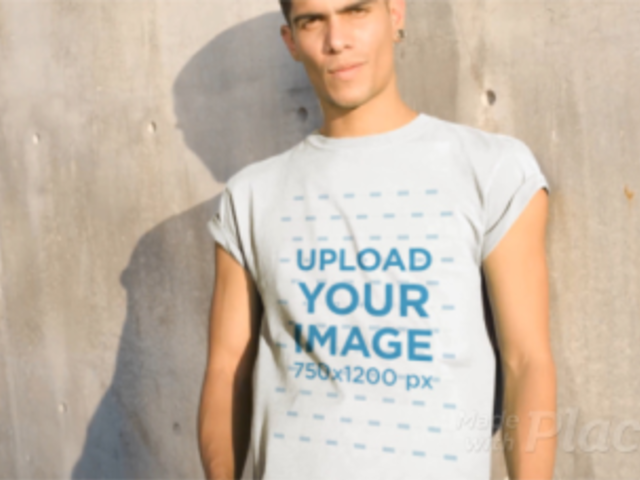 Man Wearing a Round Neck Tee Video Against a Concrete Wall a13494