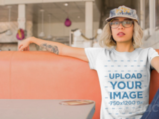 Edgy Woman with a T-Shirt Video Having a Burger at a Diner Restaurant a13464