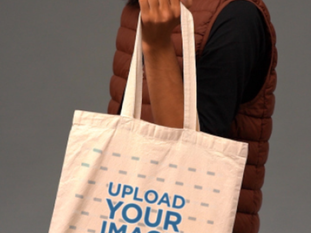 Video of a Long-Haired Man Holding a Tote Bag 5812v