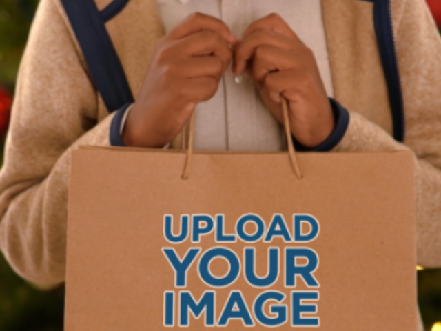 Video of a Cute Smiling Boy Carrying a Paper Gift Bag for Christmas 6047v