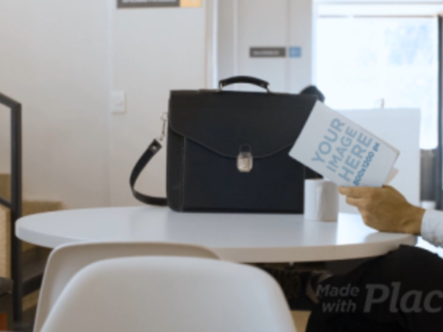 Businessman Reading a Book Video Mockup Sitting in his Living Room a14153