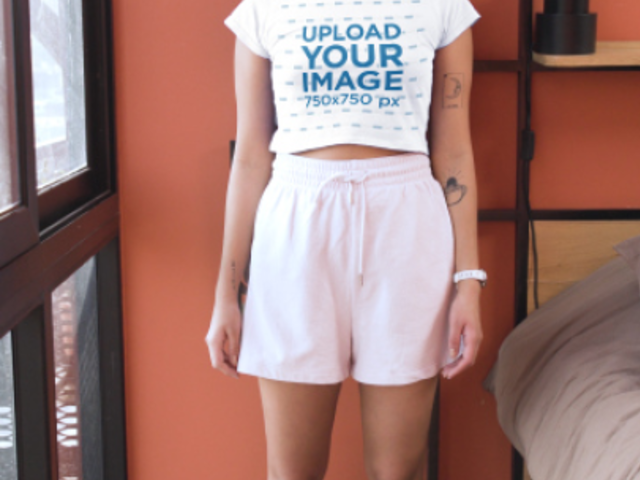 Sweatshirt and Crop Top Video Featuring a Smiling Woman With a Bucket Hat 6683v