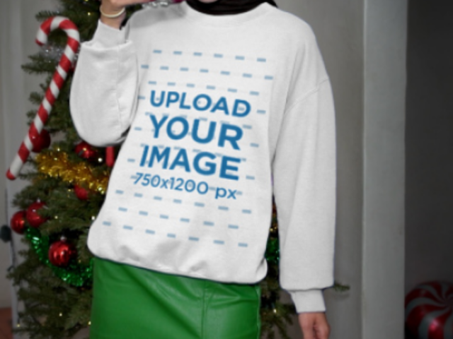 Gildan Sweatshirt Video Featuring a Happy Woman at a Christmas Party Taking a Picture 7319v