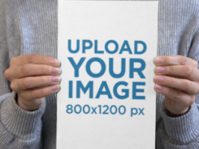 Video of a Cropped-Face Woman Holding a Hardcover Book 7612v