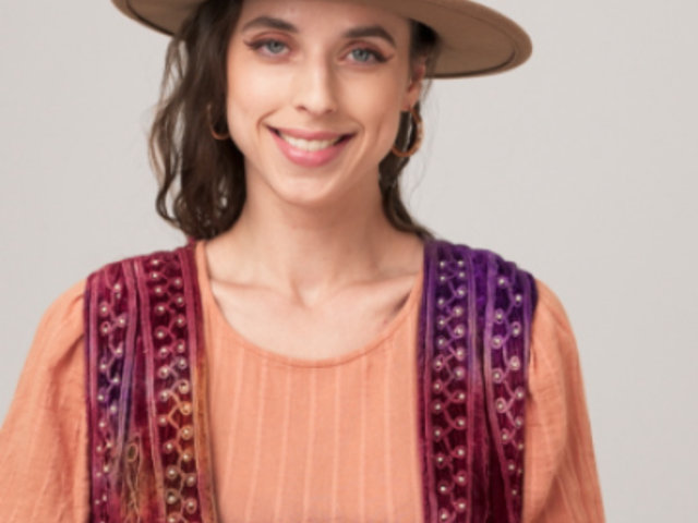 Boho-Themed Video of a Smiling Woman Holding a Coffee Mug 7715v