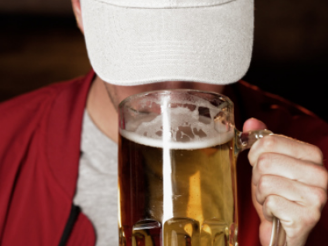 Dad Hat Video of a Man Drinking Beer in a Sports Bar 8626v