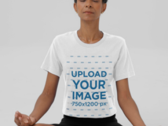 Bella Canvas T-Shirt Video of a Calm Woman Practicing Yoga in a Studio 8922v
