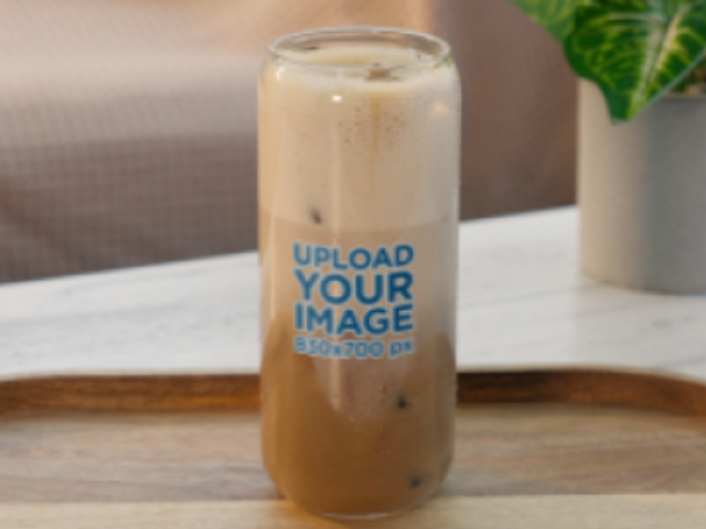 Video of a Can Glass Filled With an Ice Latte Placed on a Table 9104v