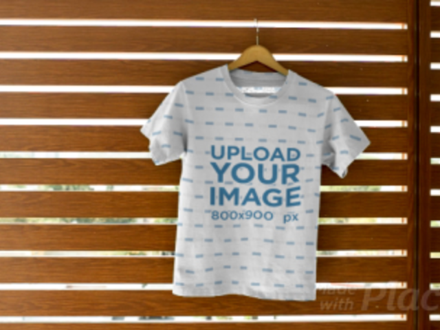 Tee Video Maker Featuring a T-Shirt Hanging on a Wall 13859