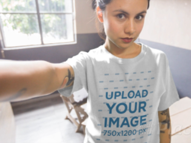 T-Shirt Video of a Tattooed Young Woman Taking a Selfie 17109