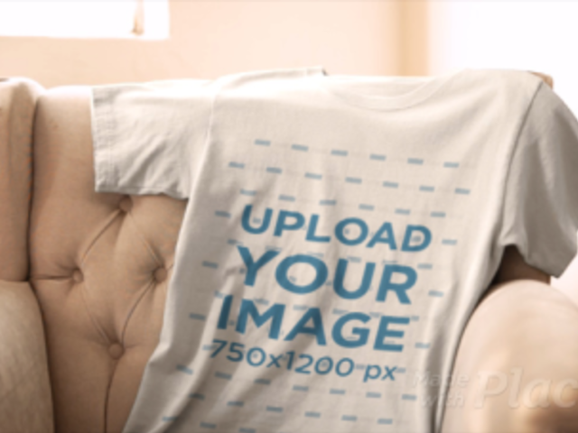 Video of a T-Shirt Lying on an Armchair Next to a Window 13065