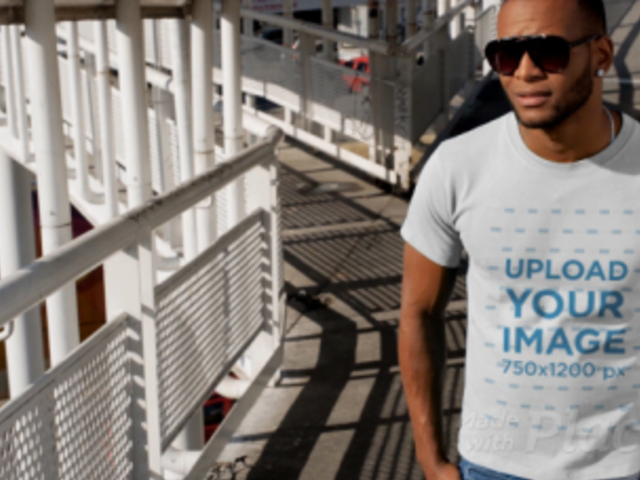 T-Shirt Video of a Man Standing on a Pedestrian Bridge 12877
