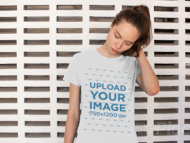 T-Shirt Video of a Woman Standing in Front of a Patterned Wall 12915