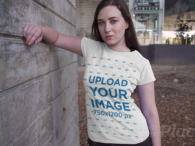 T-Shirt Video Featuring a Serious-Looking Woman by a Concrete Wall 3022