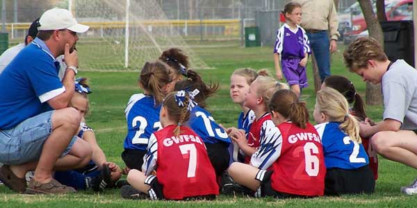youth sports girls team huddle
