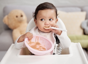 Shot of a baby eating a meal at home speech therapy feeding therapy
