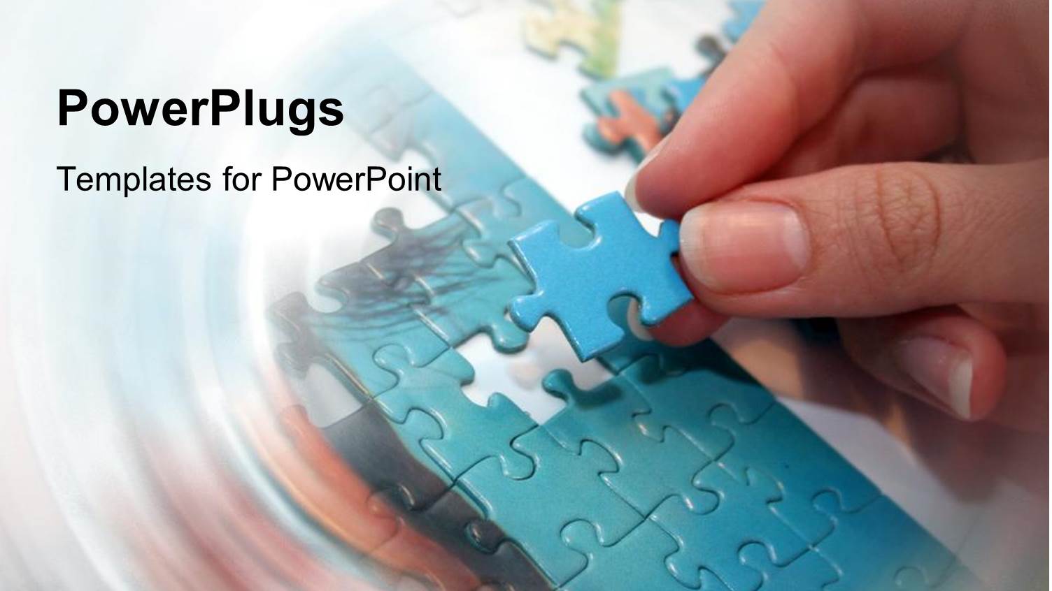 Adult Female Hand Arranging Blue Puzzle Pieces on a Blurry Background