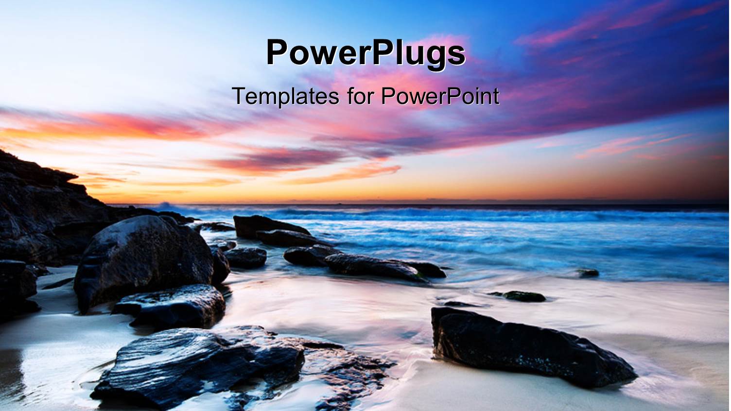 Beautiful Field with Black Rocks in Beach Sand and Colored Sky